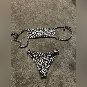 Two swimsuit sets. Cheetah and reptile print.